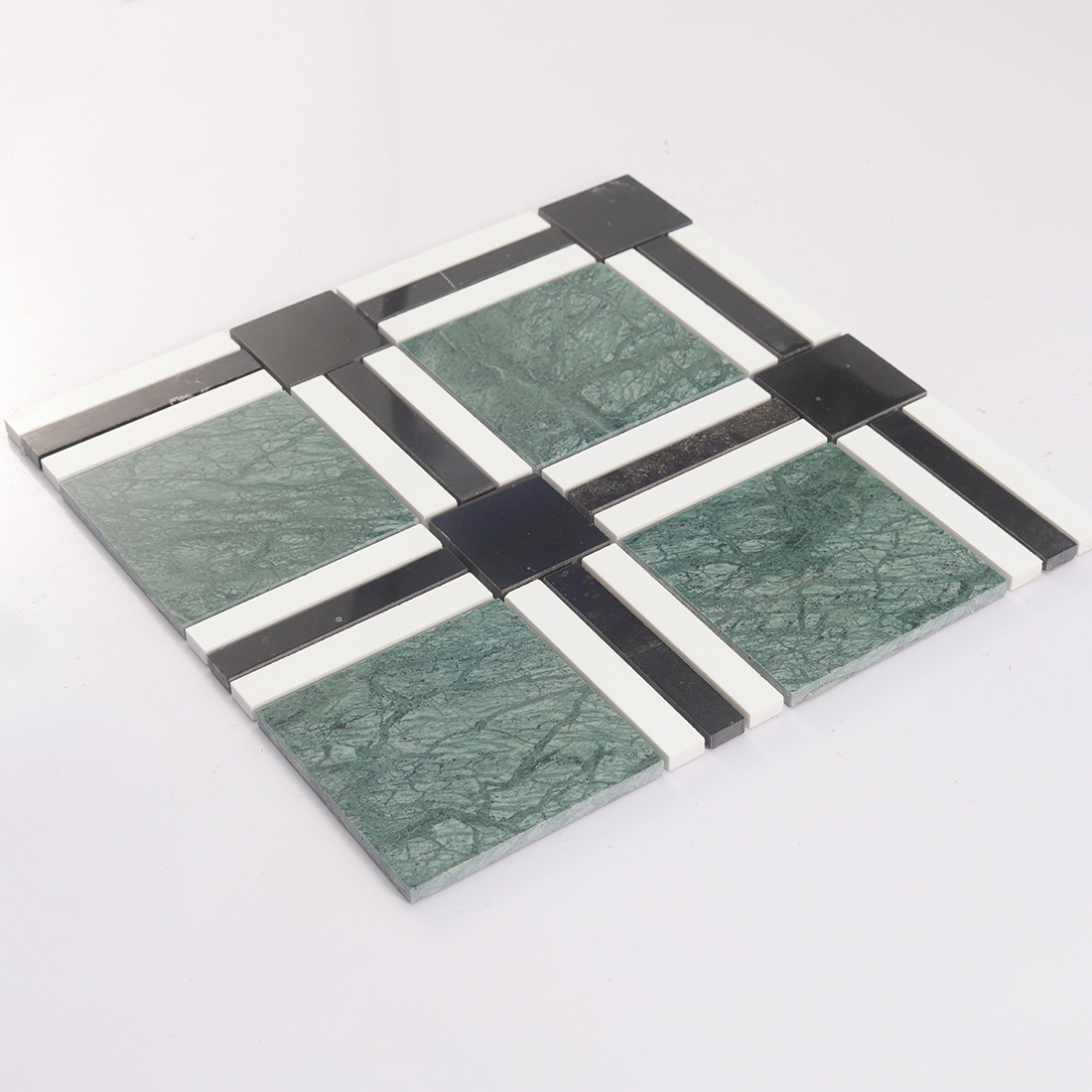 Low angle view of green black white plaid marble tile with geometric lines