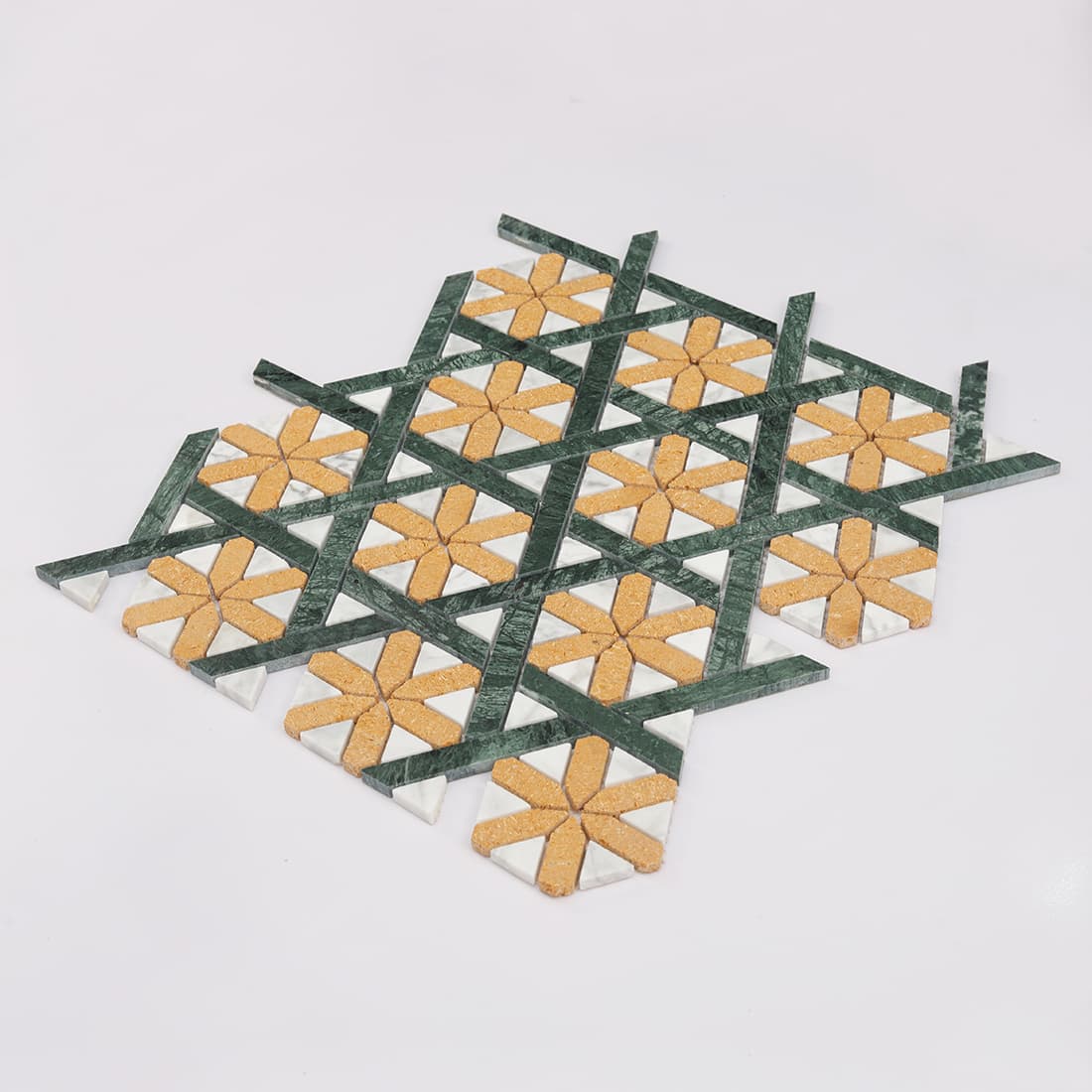 Angled view of green gold geometric marble mosaic tile sheet