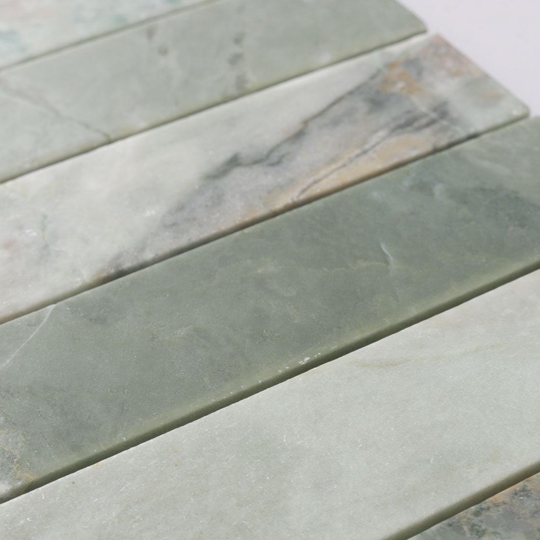 High angle view of green linear marble mosaic tiles in parallel