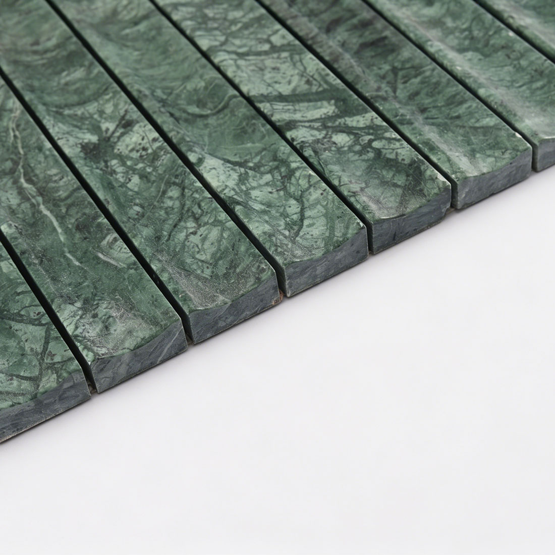 Precise edge profile of high-end emerald green marble fluted linear tile.