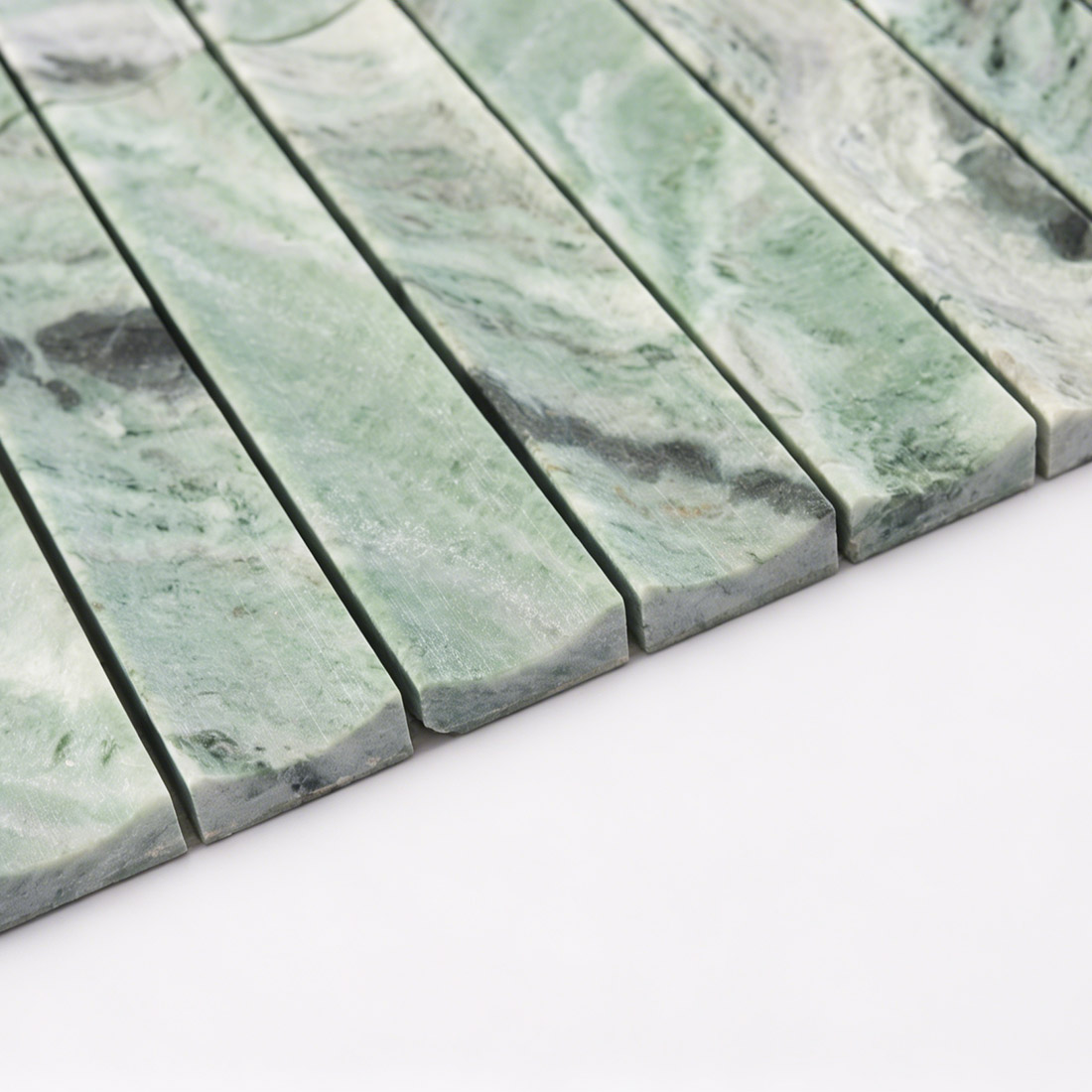 Edge profile of fluted green marble stacked tile.