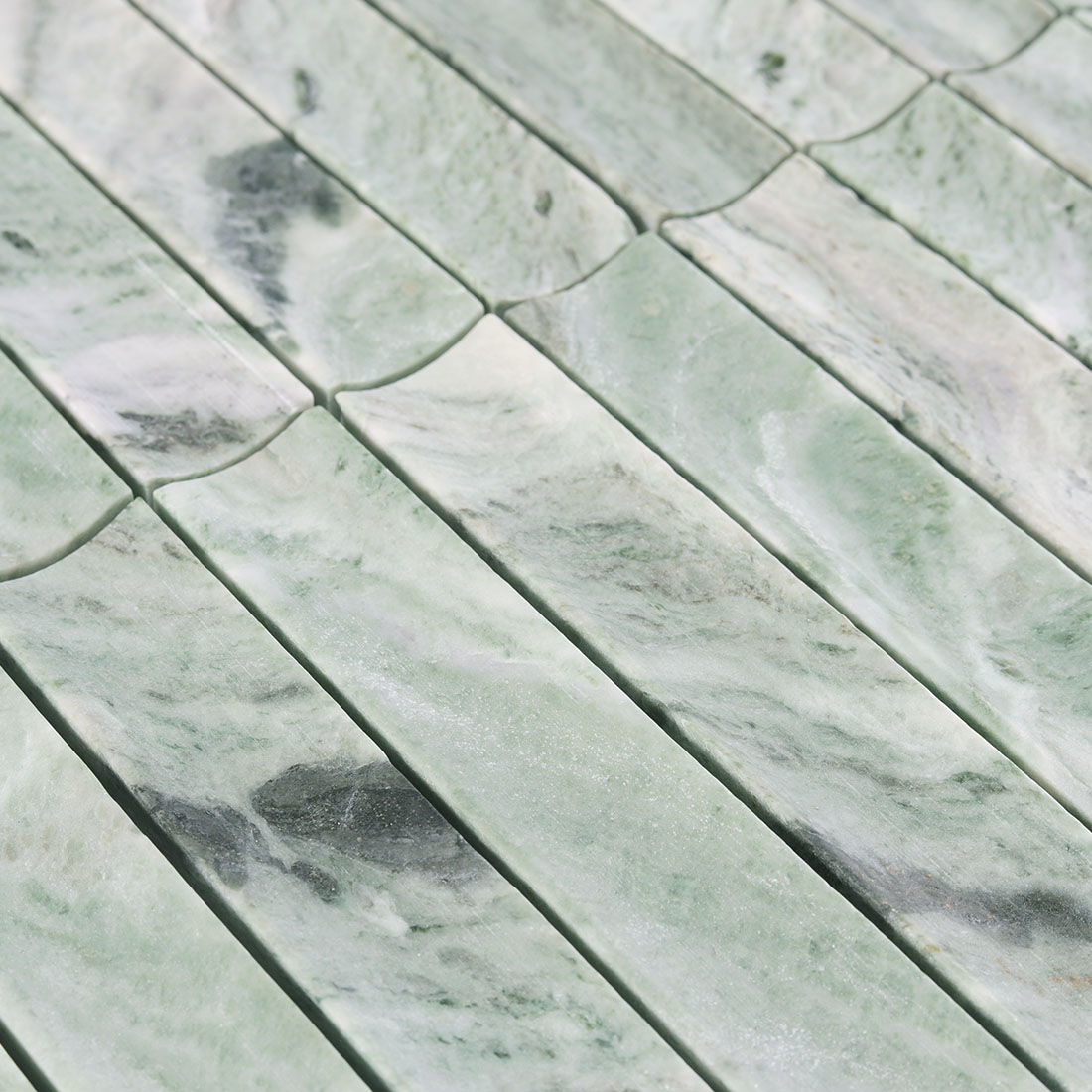 Surface texture and veining of green fluted marble.