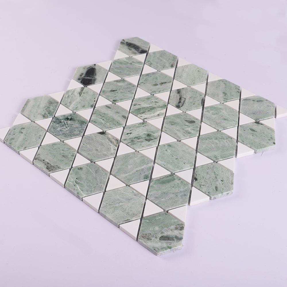 Angled view of green marble hexagon mosaic with white triangle accents
