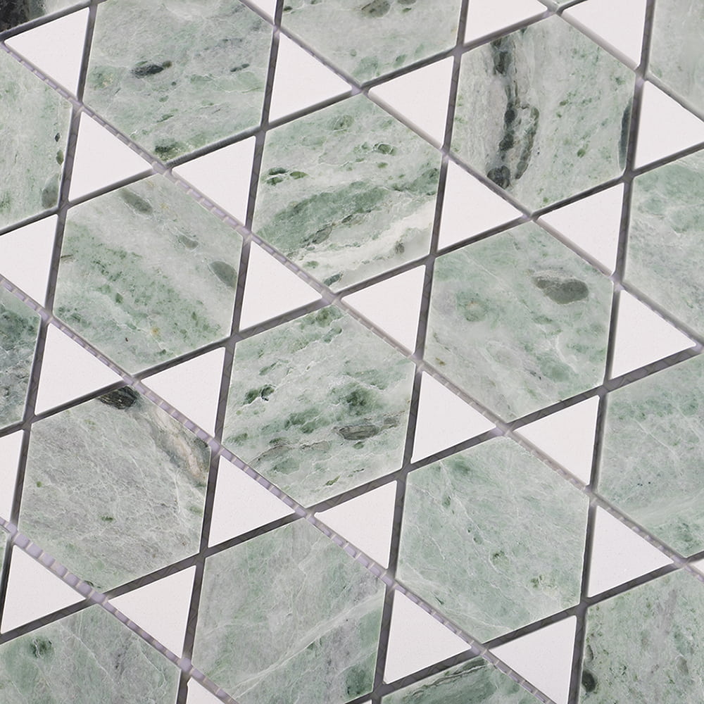 Close up of green marble hexagon mosaic with white geometric triangle pattern