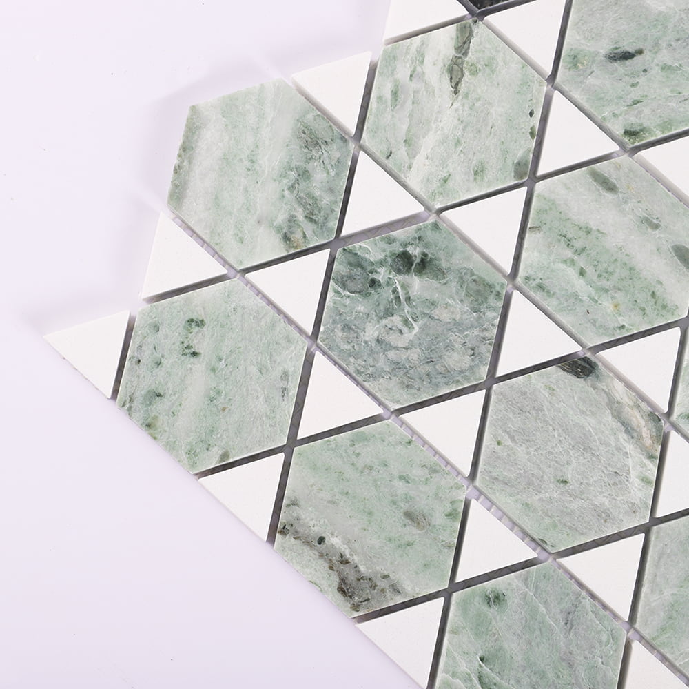 Corner detail of green marble hexagon mosaic with white triangle inserts