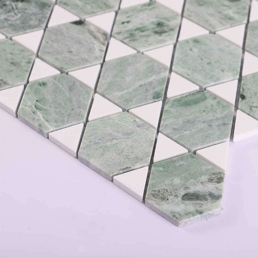 Edge detail of green marble hexagon mosaic sheet with white triangle pieces