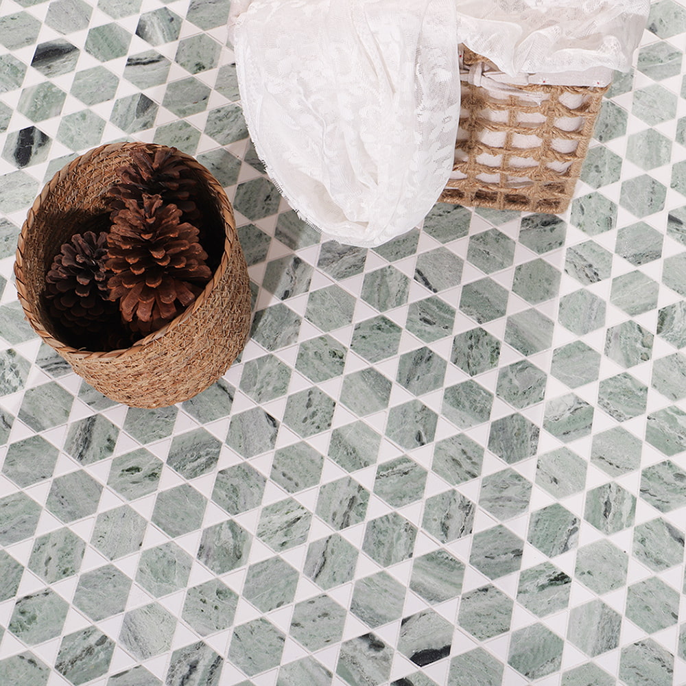 Green marble hexagon mosaic floor scene with woven basket and pine cones