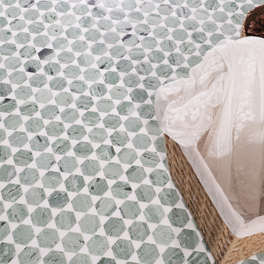 Green marble hexagon mosaic scene with soft fabric and woven basket