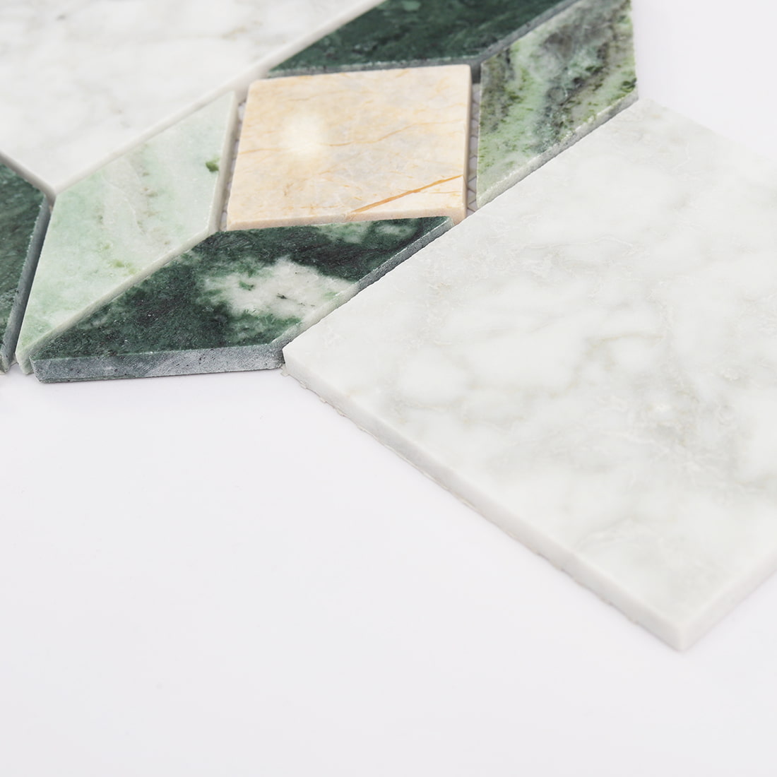 Side detail of green beige and white marble geometric mosaic tile pieces