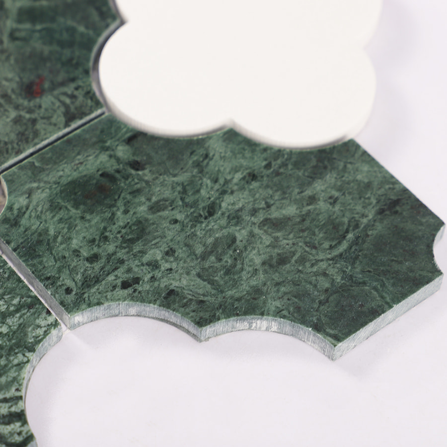 Side detail of green marble mosaic tile showing thickness and curved edge profile