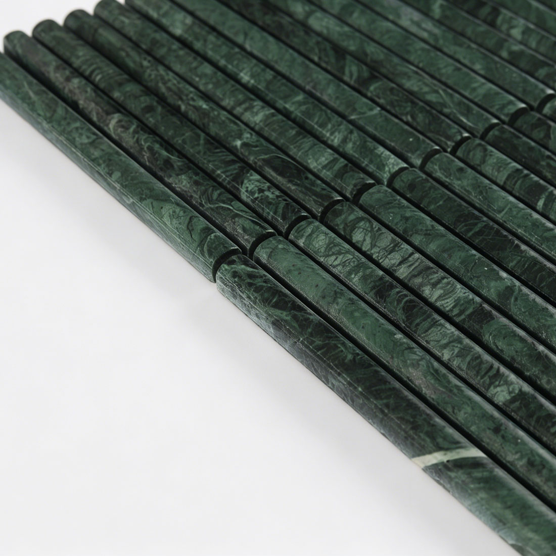 Side profile view highlighting the rod contour of green marble.
