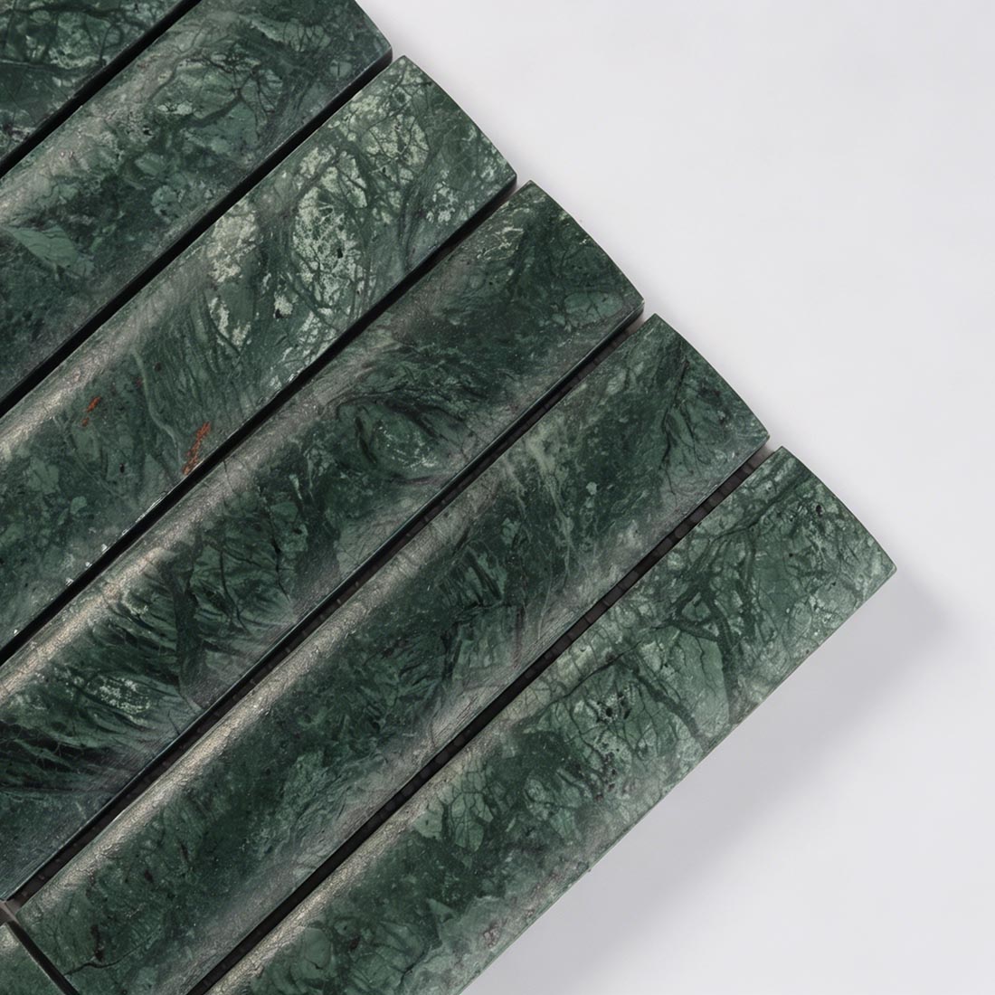 Close up of green marble soft edge bar tile with natural veining