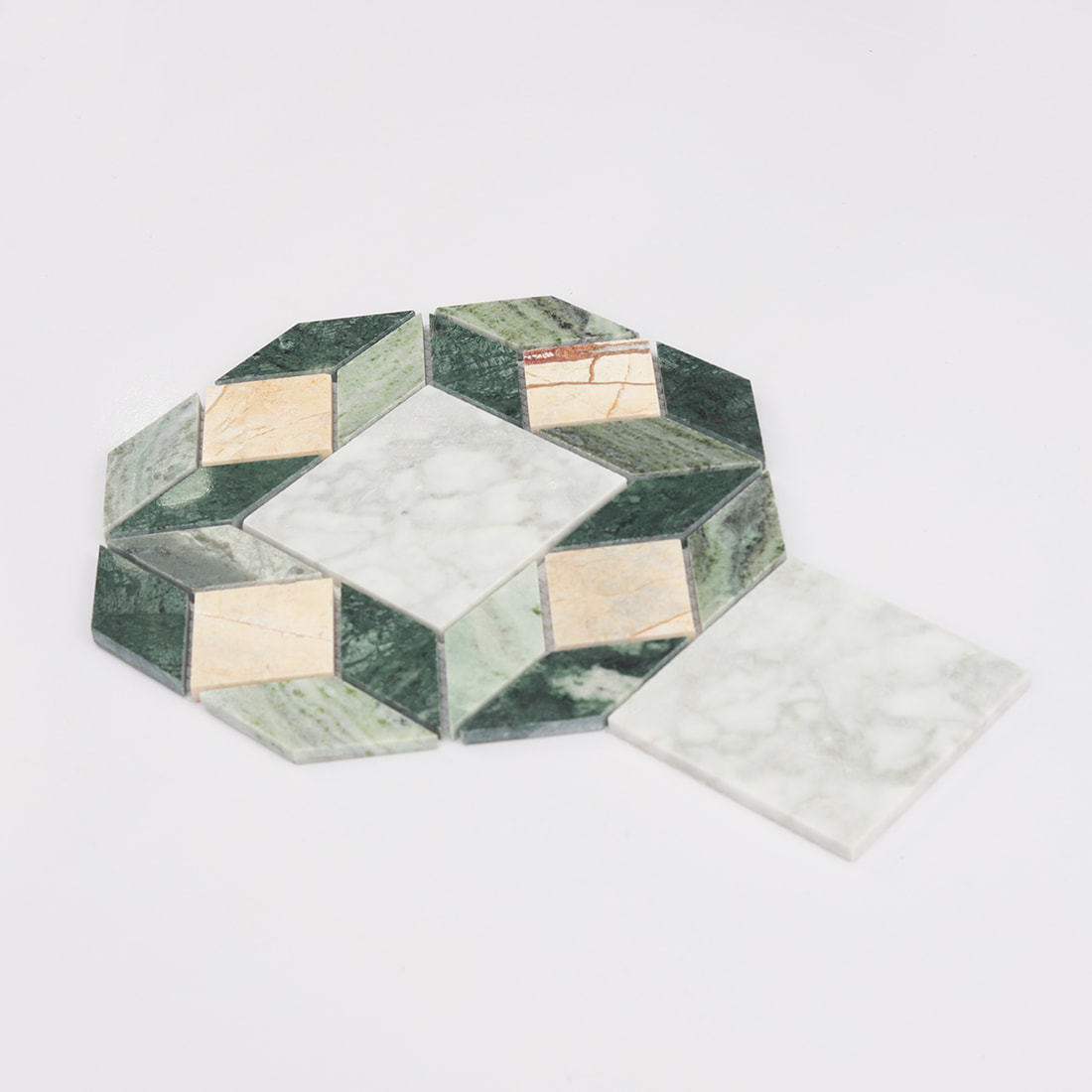 Angled view of green beige and white octagon marble mosaic tile sheet