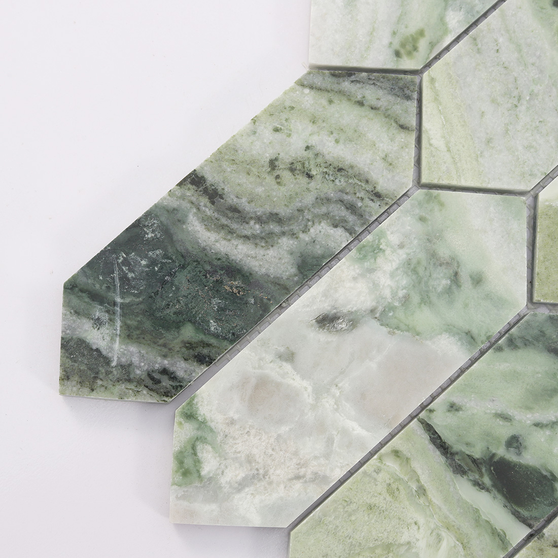 Close up of green picket marble mosaic with mixed natural stone veining