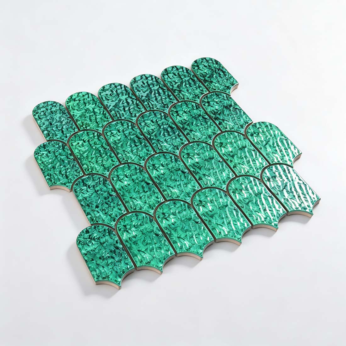Angled perspective view of green scallop metal wall mosaic tile sheet