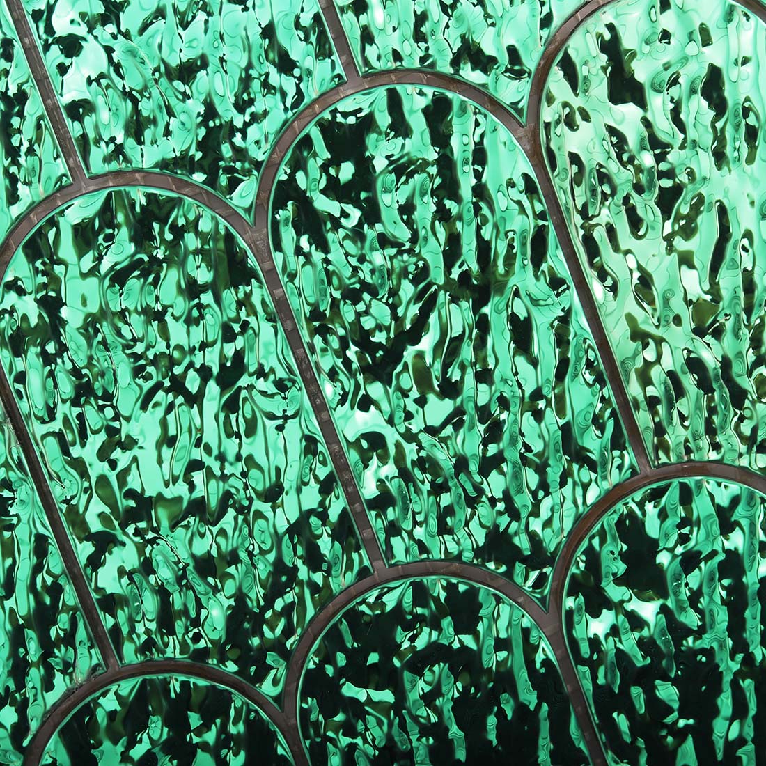 Top view showing water ripple texture on green scallop stainless steel tile