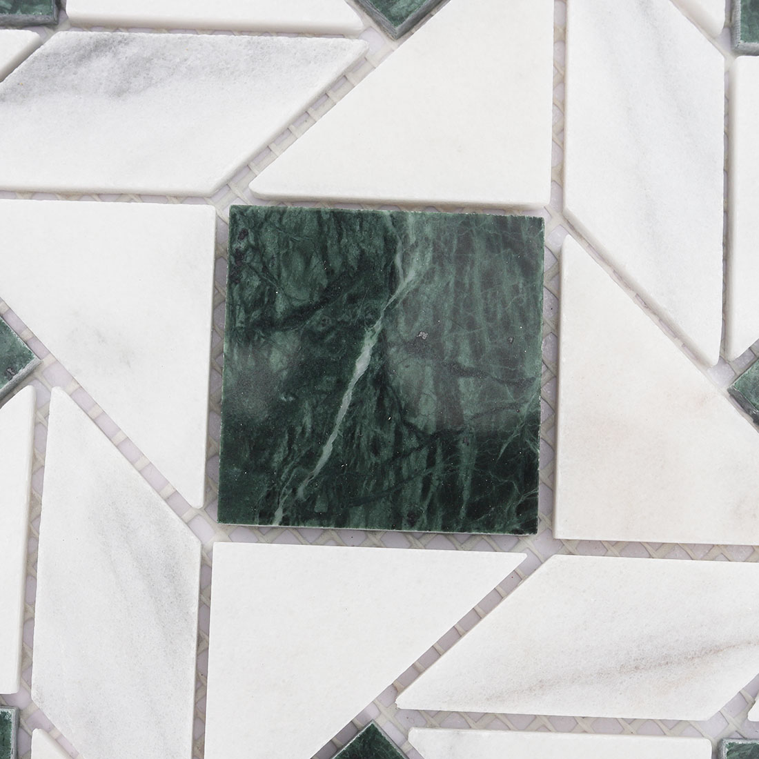 Texture of green square marble chips and white triangle marble mosaic tiles.