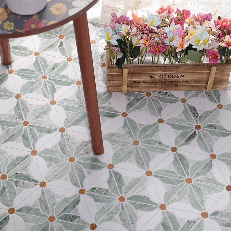Green and white floral marble floor tile with gold dot accents