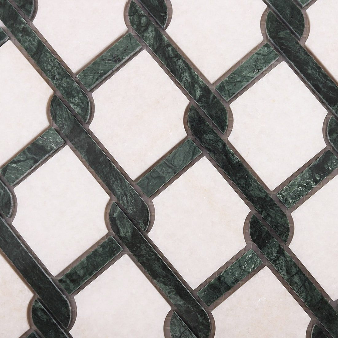 Geometric green and white marble mosaic tile pattern in repeating layout