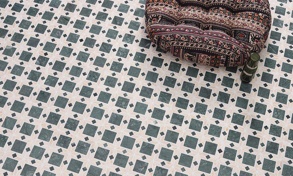 Green and white geometric matte floor tile in boho interior scene