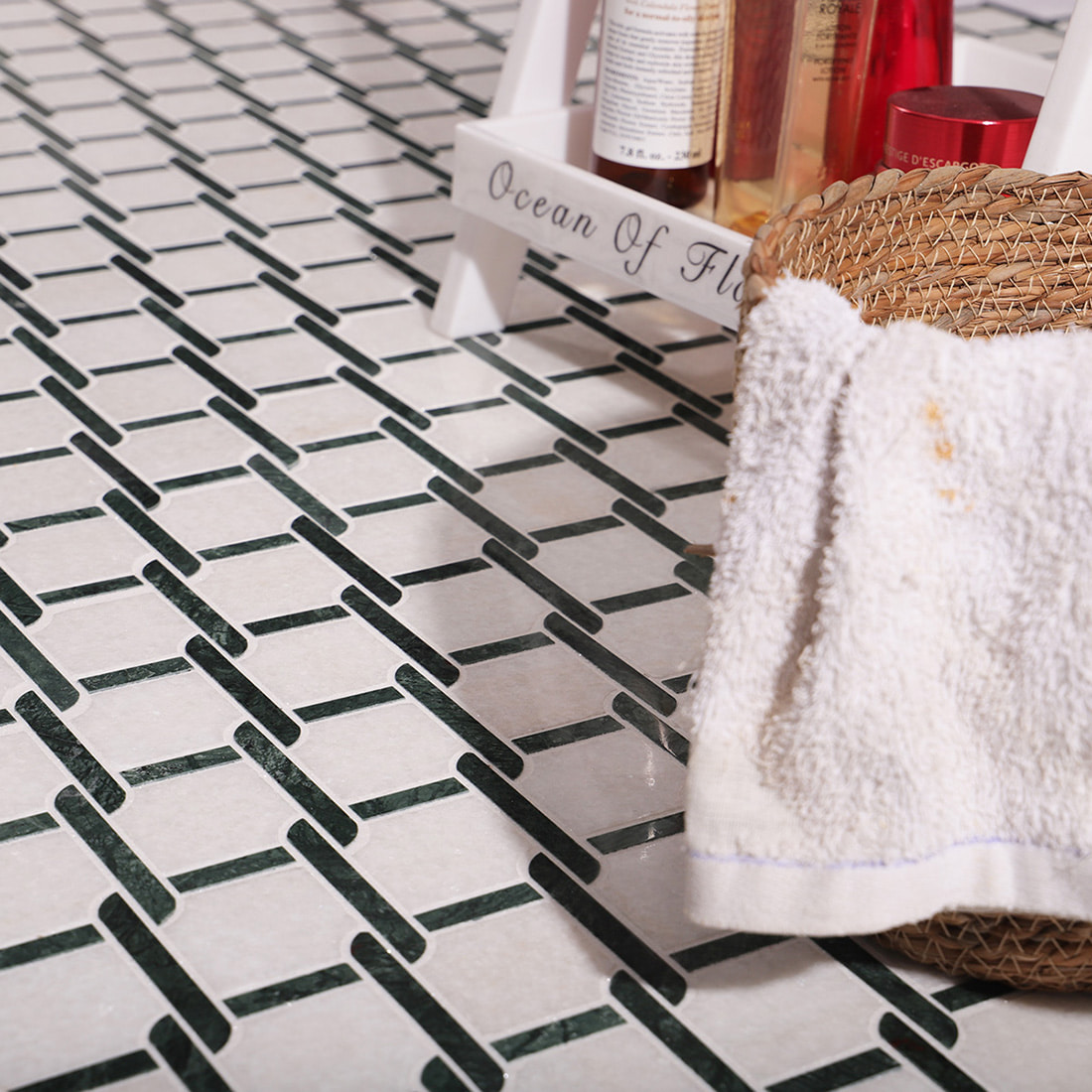 Lifestyle scene of green and white marble mosaic tile flooring in bathroom