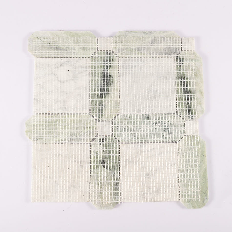 Back view of green and white marble mosaic tile with mesh backing