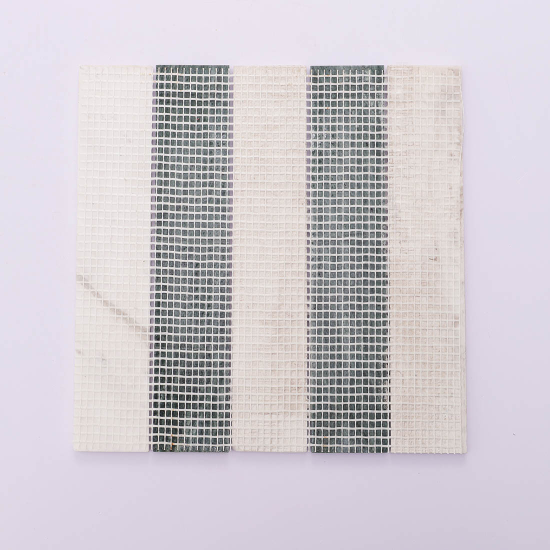 Back view of green and white vertical marble mosaic tile with mesh backing.
