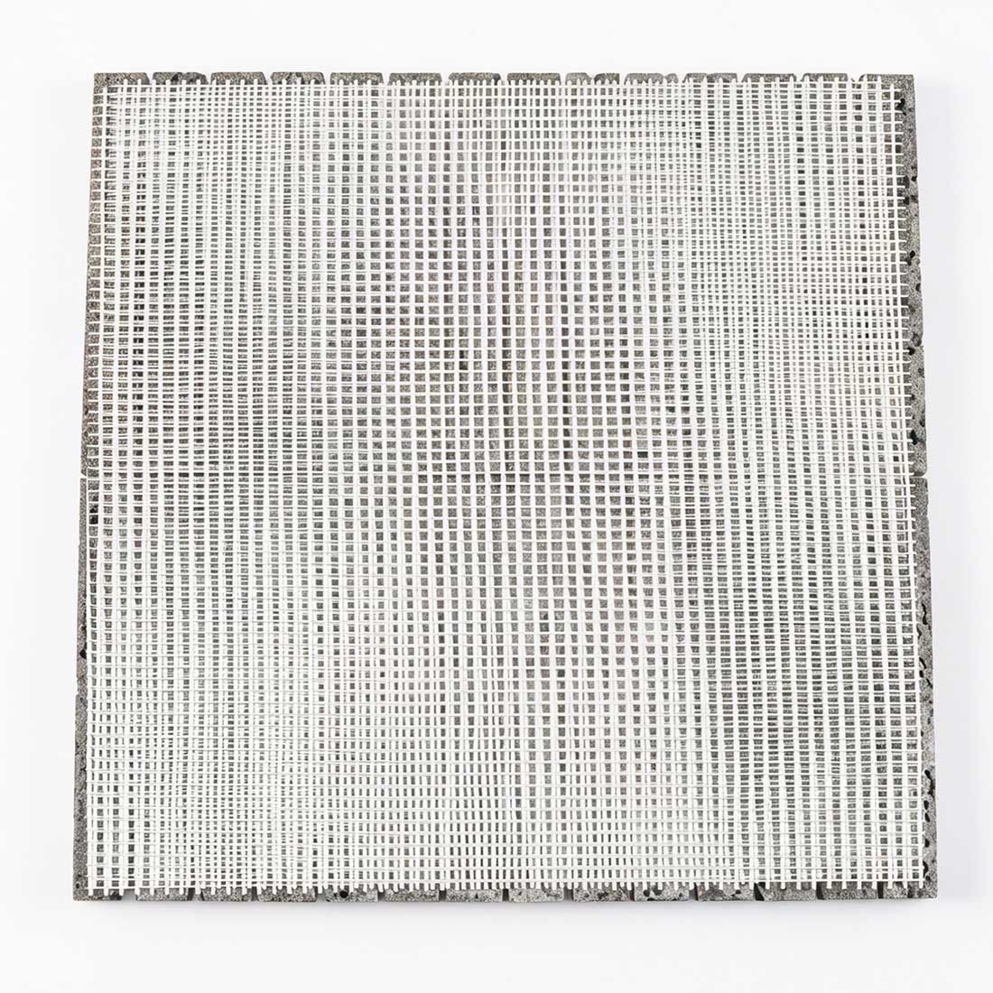Mesh backing on grey lava stone linear mosaic tile.