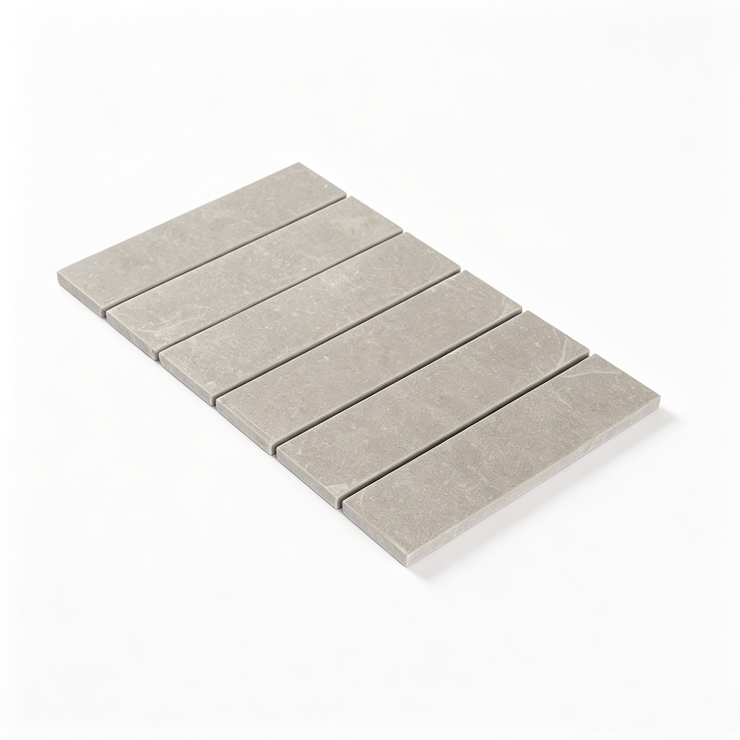 Perspective view of laid grey strip marble mosaic tiles