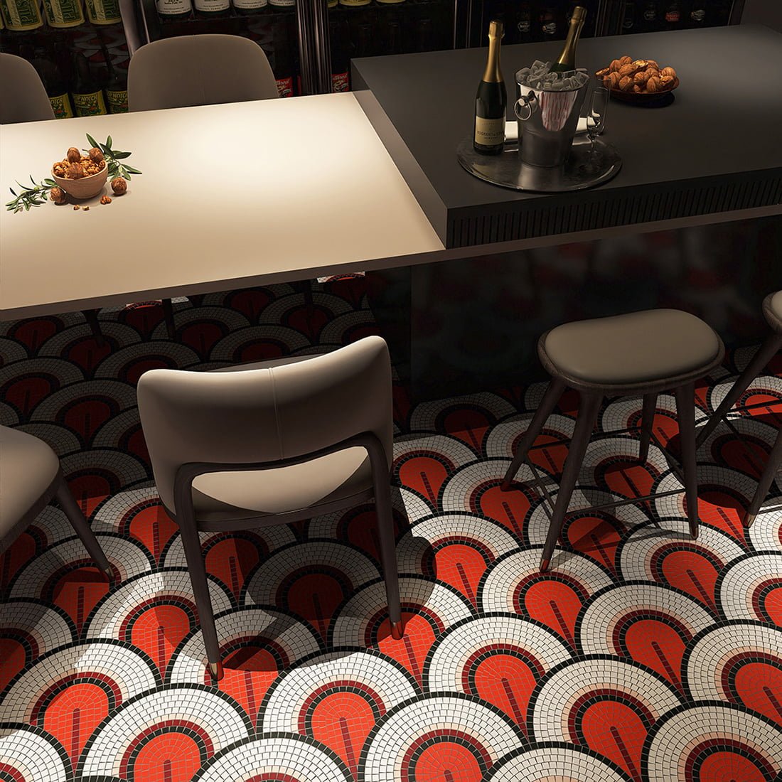 Luxury bar interior with handmade fan-pattern glass mosaic floor in red, black, and white tones.