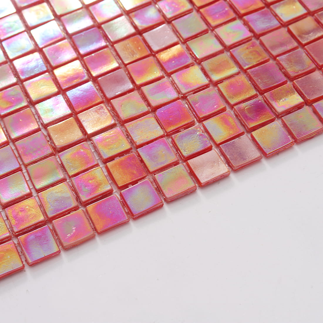 Edge view of iridescent coral rose red square glass mosaic tile