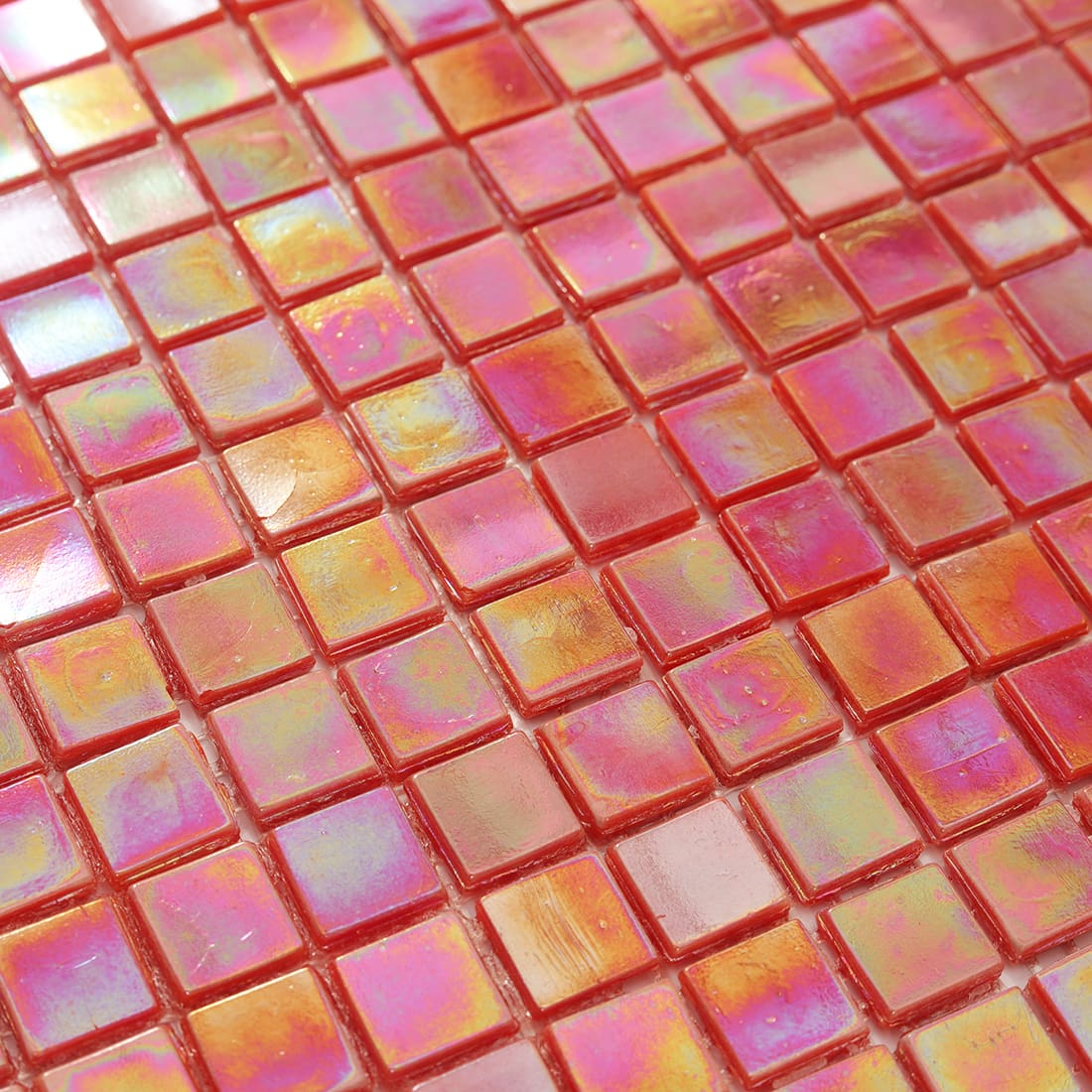 Close-up of iridescent coral rose red square glass mosaic surface