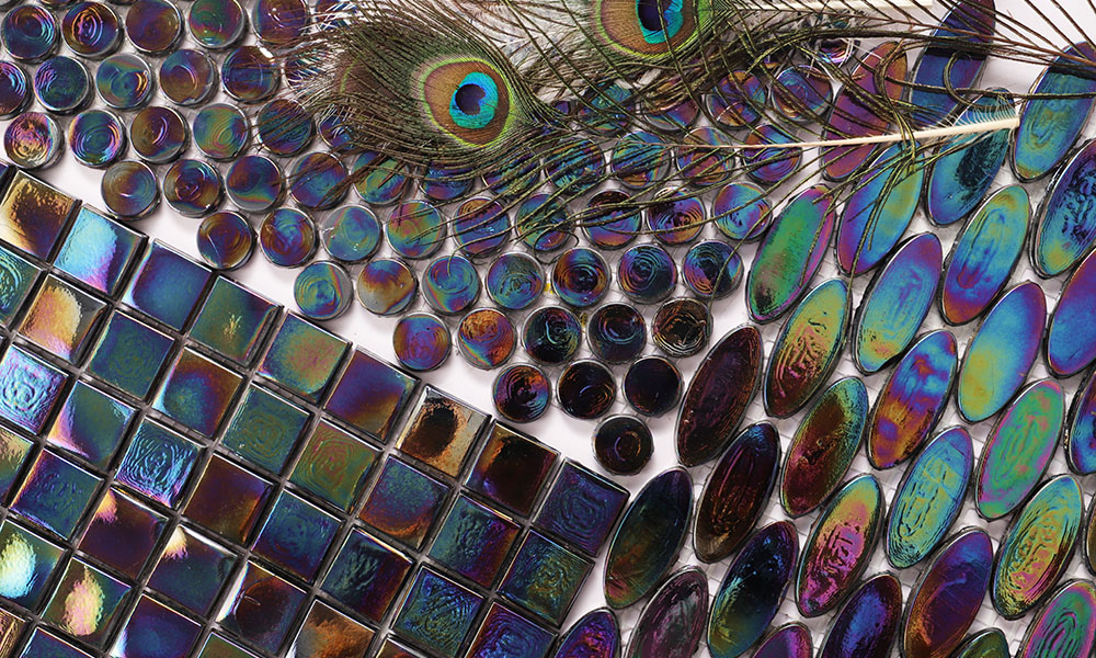 {"default":"Iridescent tiles in square, penny round, and oval shapes with peacock feathers."}
