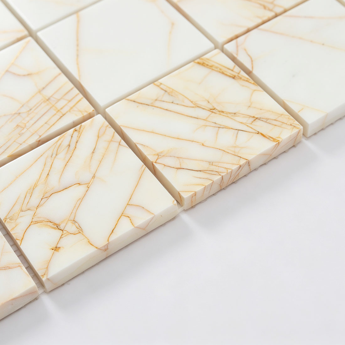 Ivory amber veined square mosaic tile surface detail