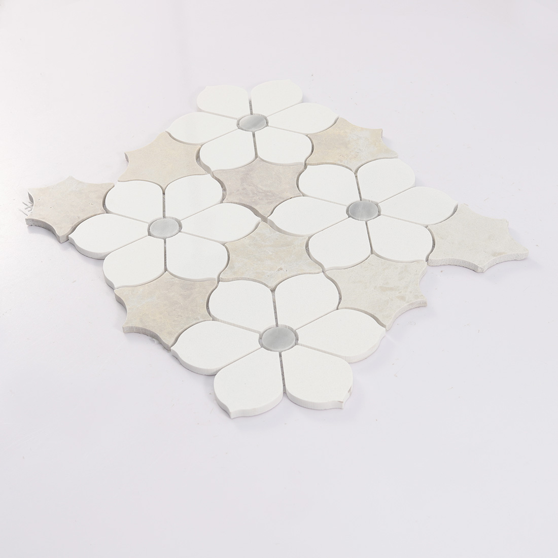Side view of ivory floral medallion stone mosaic tile with visible thickness