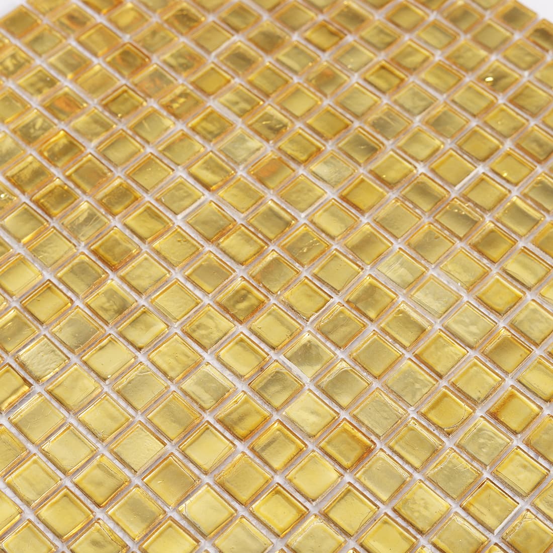 Close up of light gold square glass mosaic tile surface