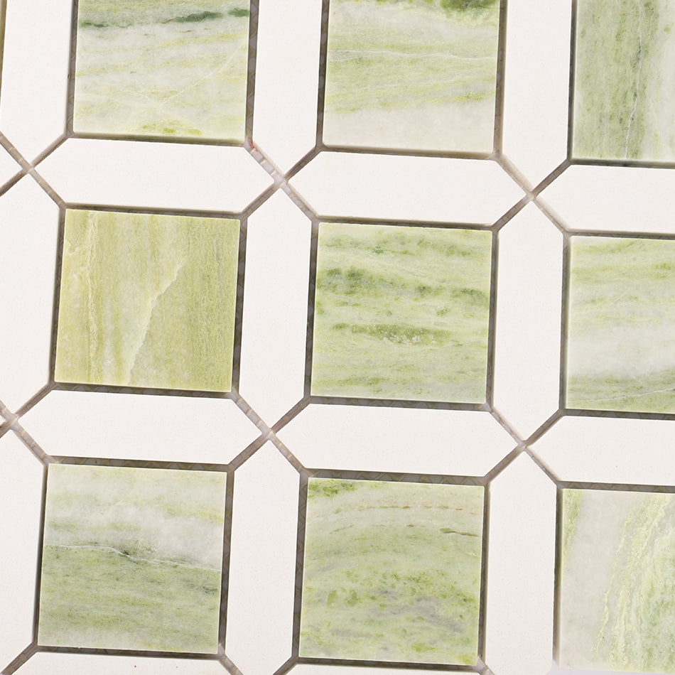 Close-up of light green marble and white geometric mosaic tile pattern