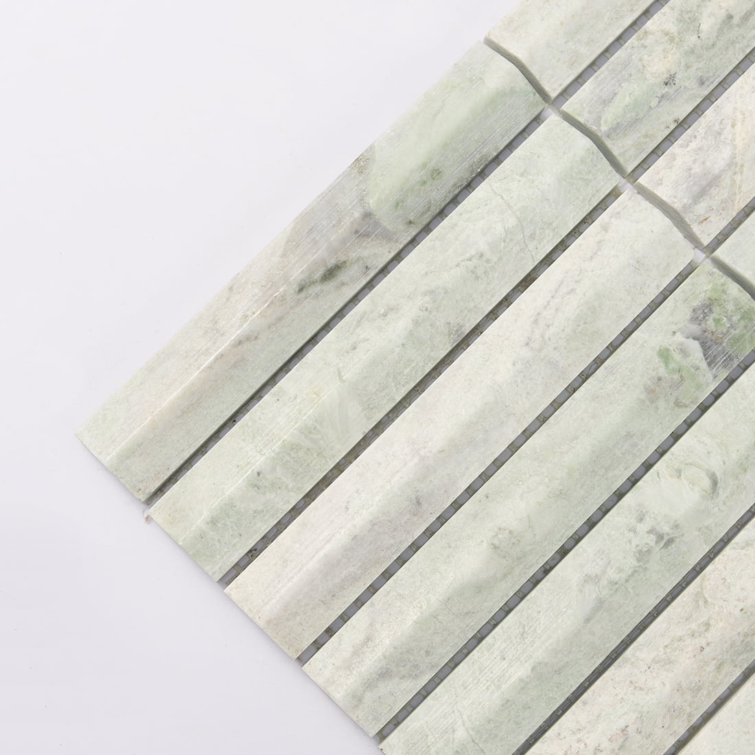 Corner detail of light green marble fluted mosaic tile