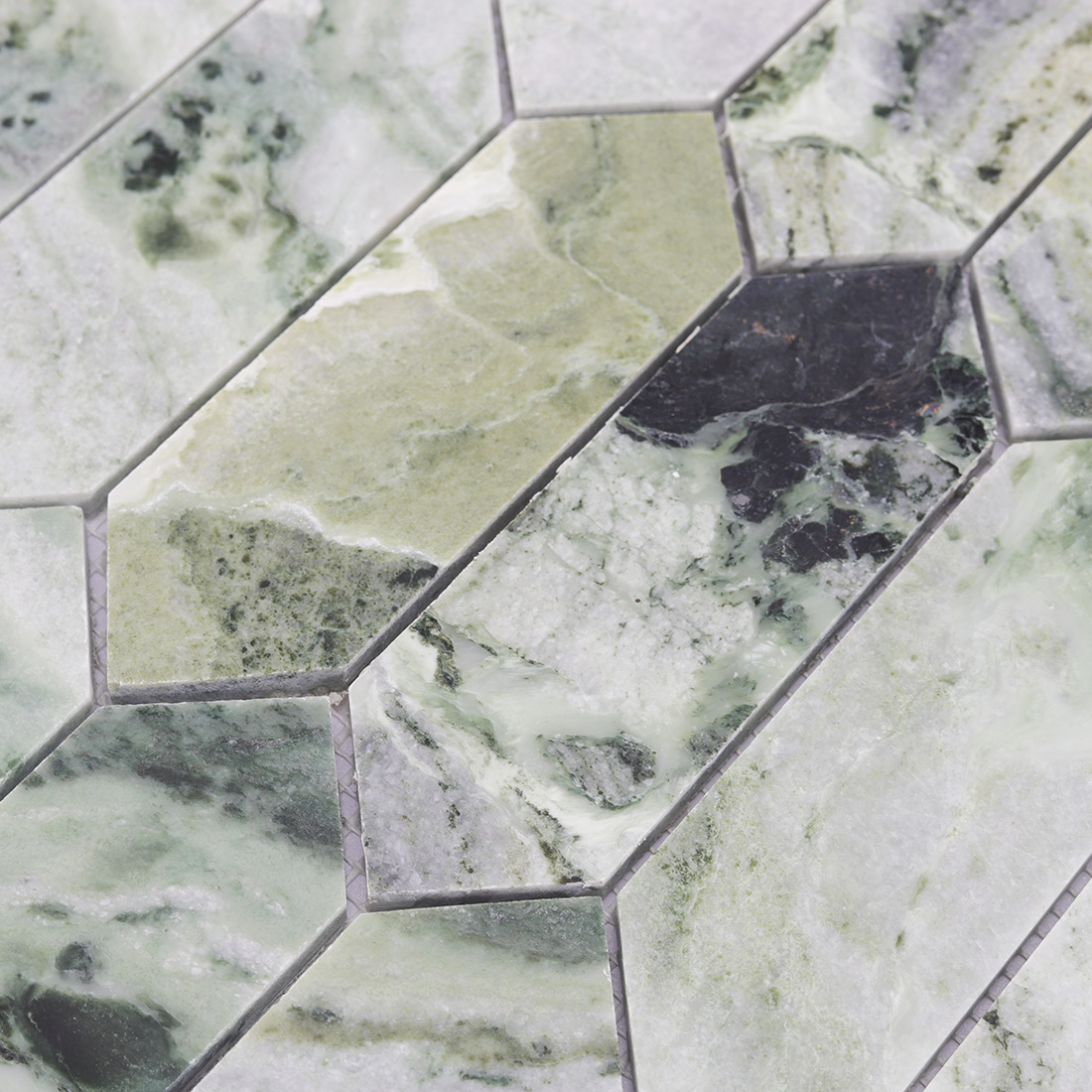Texture detail of light green marble picket tile with gray and dark veins