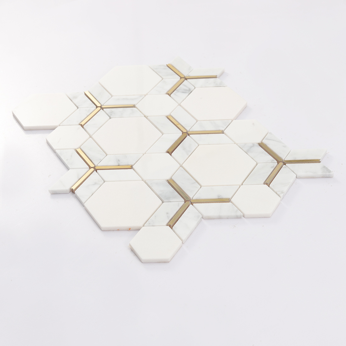 Low angle view of geometric marble mosaic with gold line framing