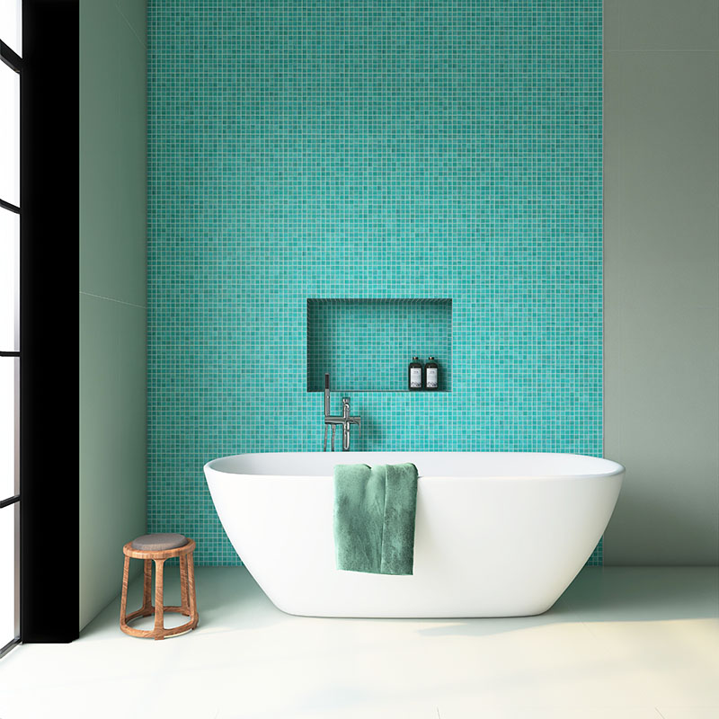 Luxury bathroom interior with turquoise mosaic tiles and a minimalist freestanding tub.