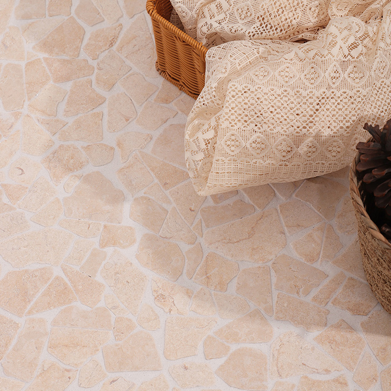 Irregular marble beige tiles in a broken mosaic pattern for bathroom floors.