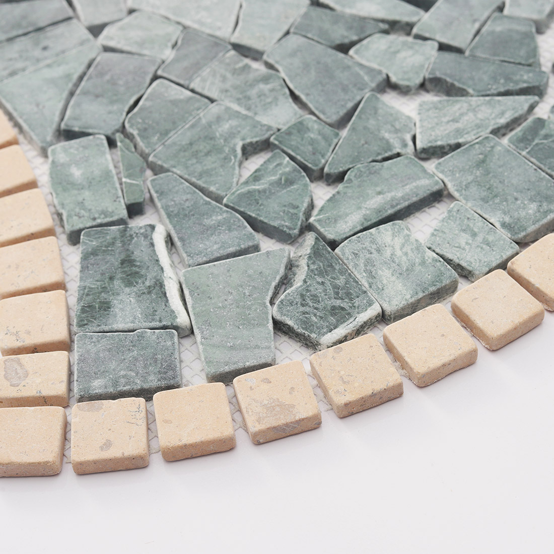 Detailed texture of green and beige marble irregular mosaic.