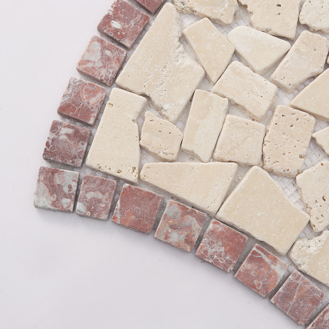 Corner detail showing the red border of the beige mosaic tile.