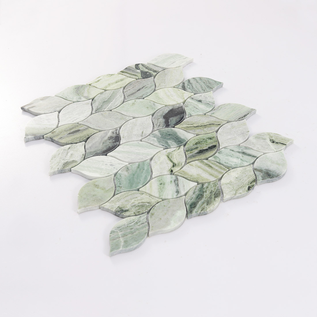 Angled view of light green marble leaf mosaic tile.