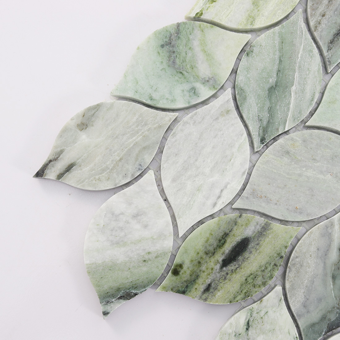 Close-up of the left edge of marble leaf mosaic tile.