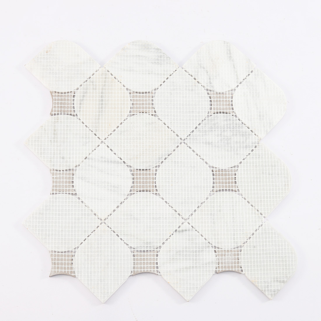 Mesh backing on the reverse side of marble petal mosaic.
