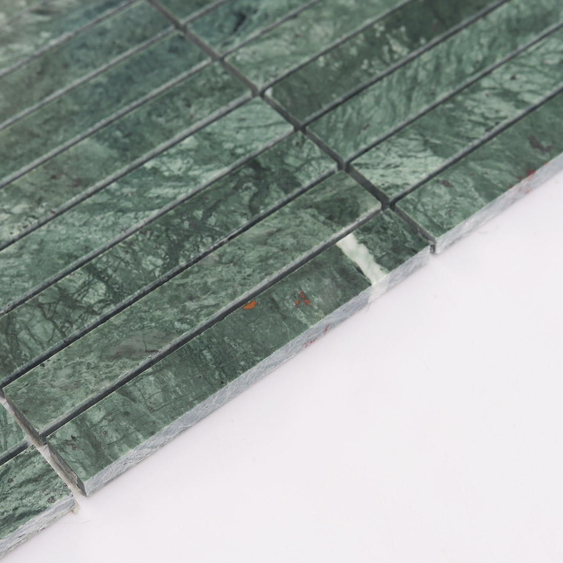 Detailed texture of green marble stacked mosaic tile.