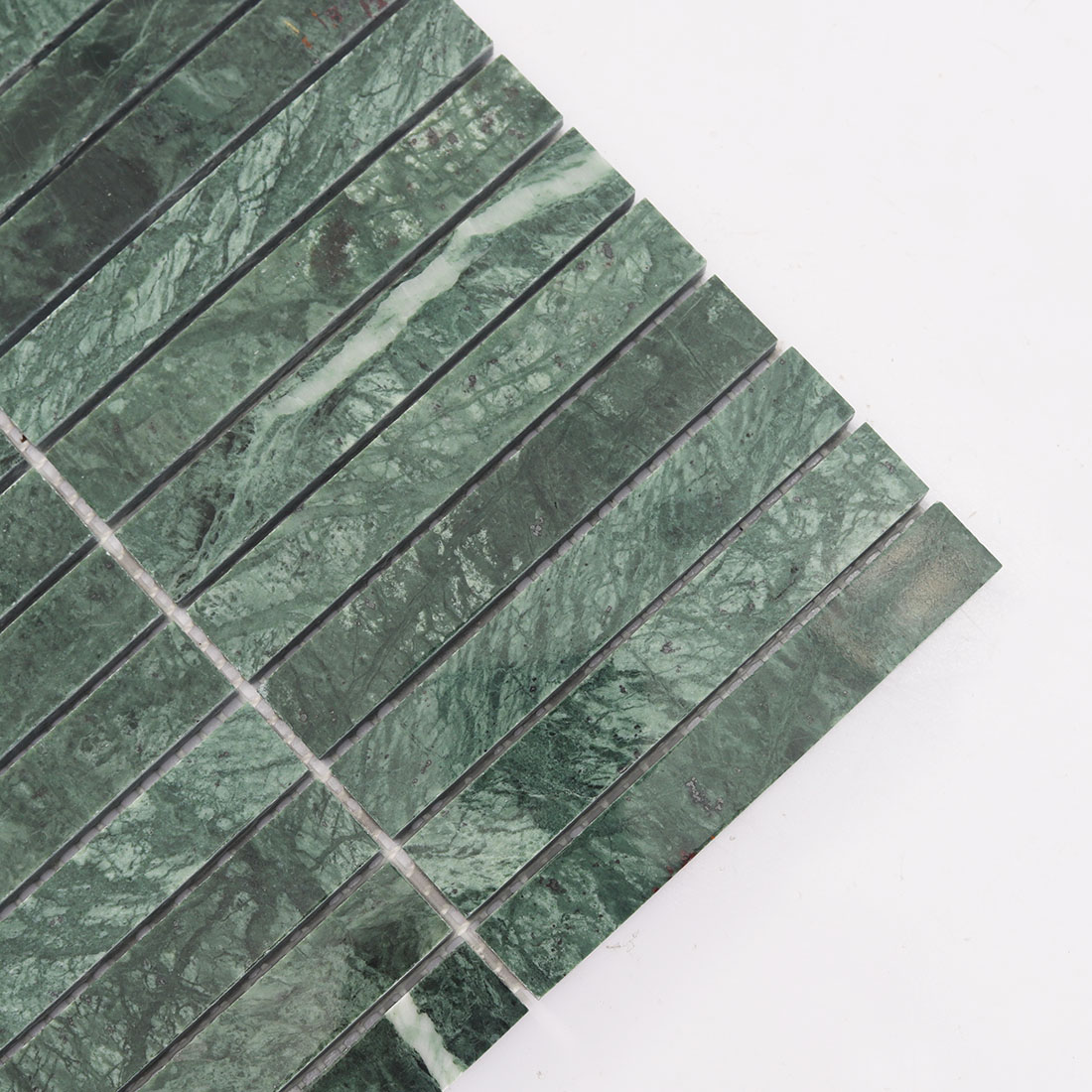 Close-up of the left edge of green marble stacked mosaic.