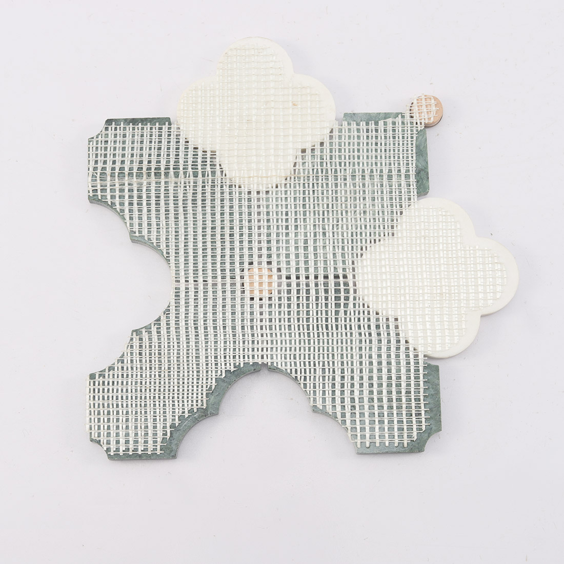 Back view of Indian green and white flower marble tile with mesh backing